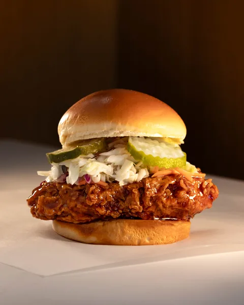 Twist chicken sandwich photographed with its original background